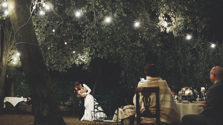 couple just married kissing at night