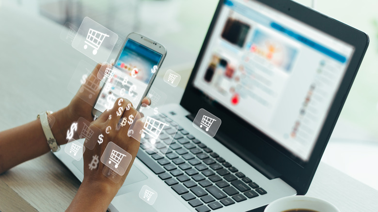 woman on phone and laptop