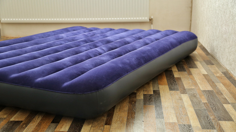 air mattress on wood floor