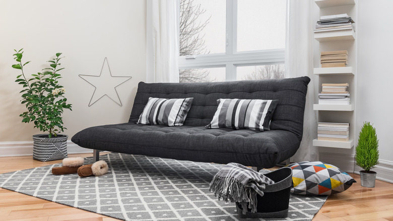 couch with pillows in living room