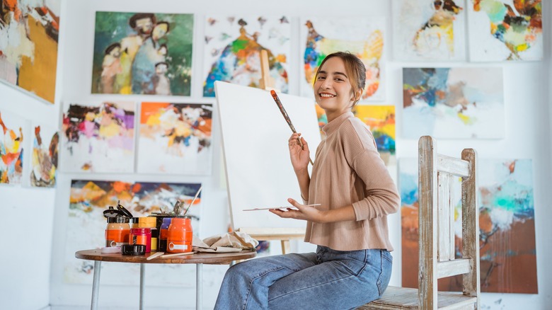 woman painting in studio