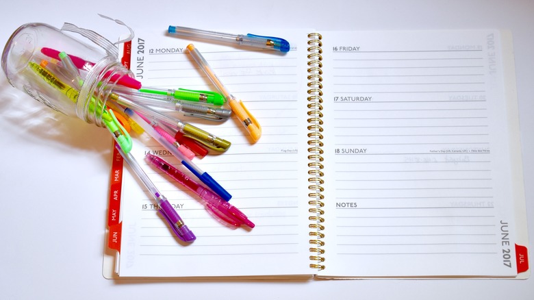 jar with spilled pens 