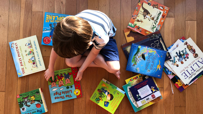 Child looking at books