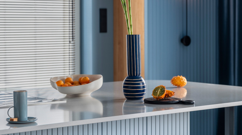 Kitchen island decor with flowers and fruit bowl