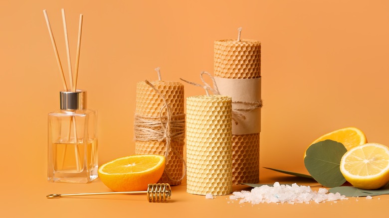 Candles, citrus fruits and a reed diffuser