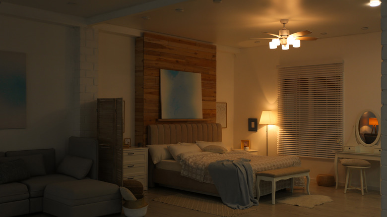 Bedroom with ceiling fan and lights