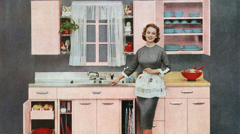 '50s style woman in pink kitchen