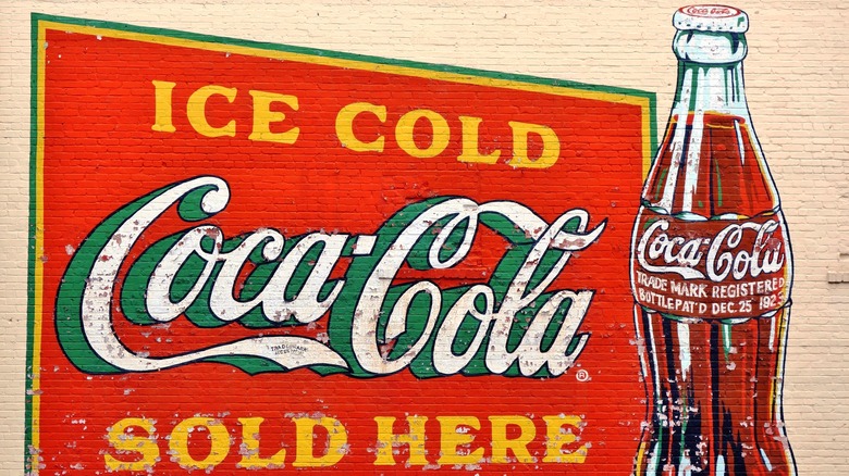 vintage coca cola sign on wall