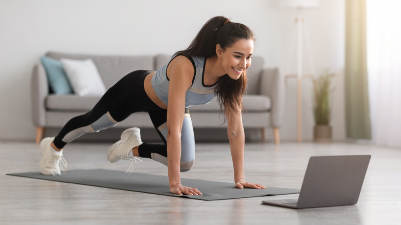 woman exercising at home