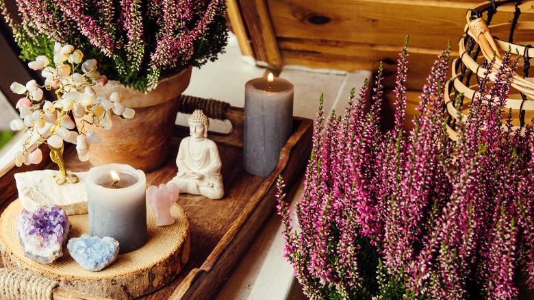 crystals and candles with flowers