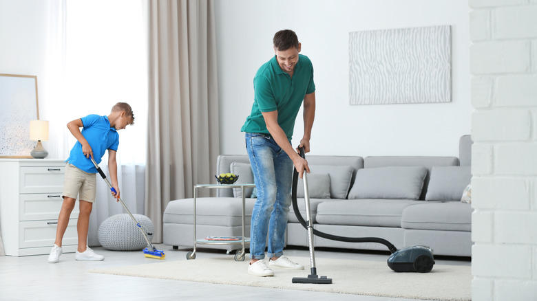 father and son cleaning together