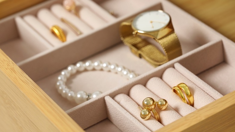 A jewelry drawer is neatly arranged