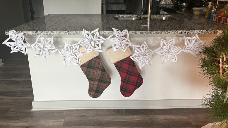 paper snowflake garland with stockings