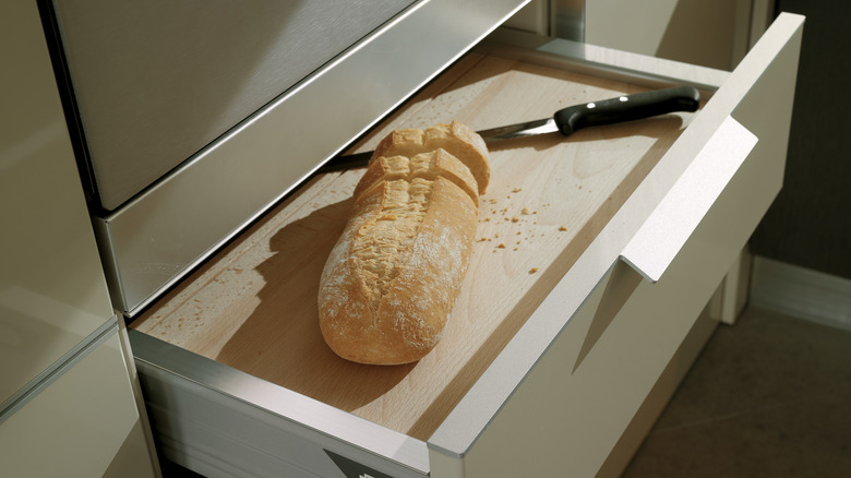 Cutting board atop kitchen drawer