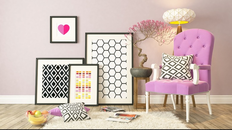Framed art and pink chair