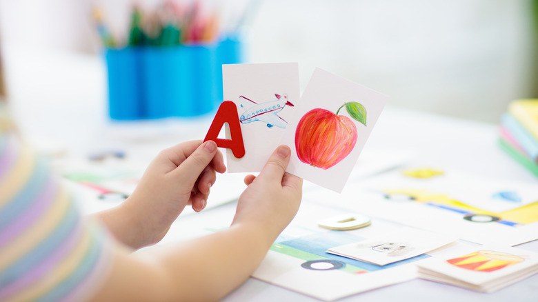 child using flashcards