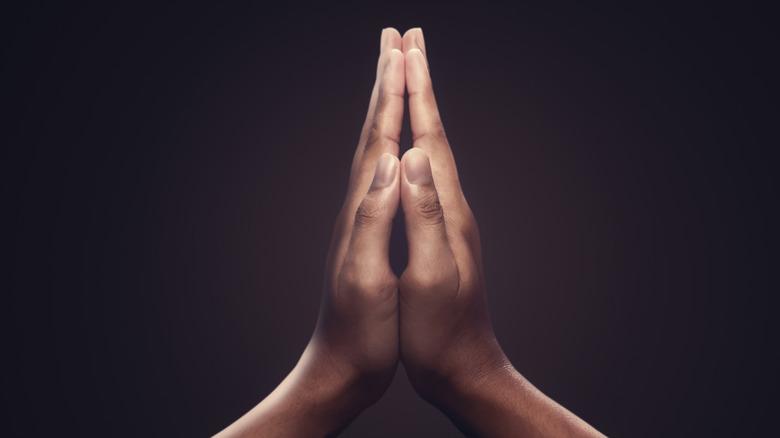 Hands closed in prayer