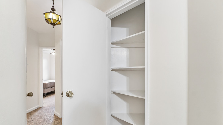 Closet with wood shelves at  weird angles