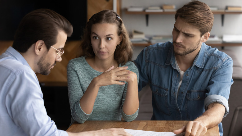 Couple talking to agent