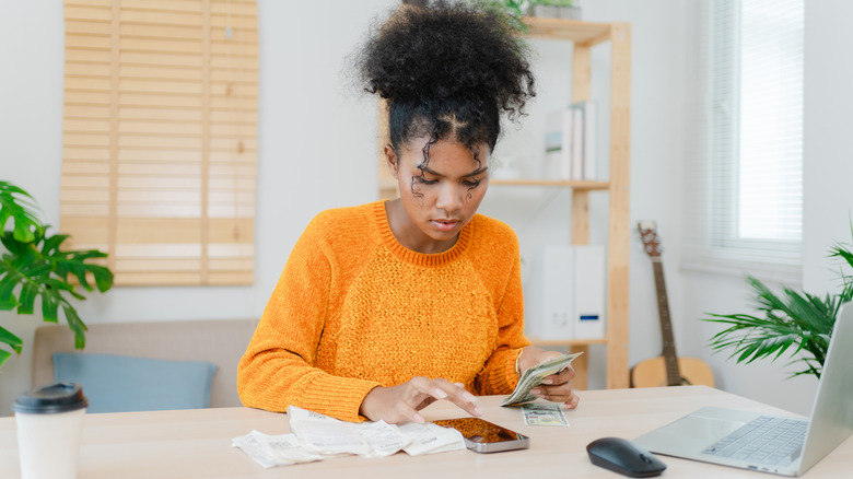 young woman counting money