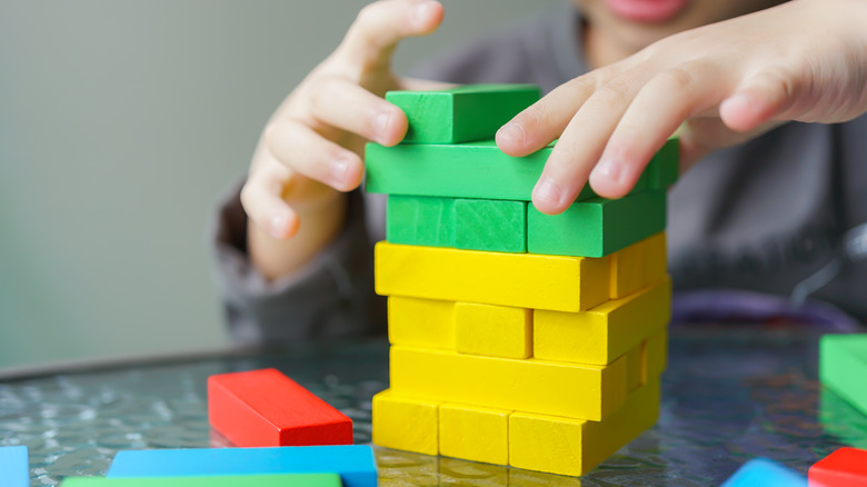 child playing with building blocks