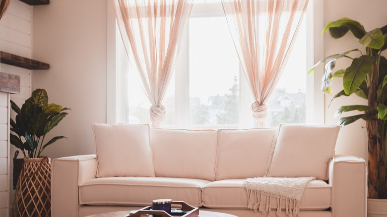 sheer curtains in neutral room