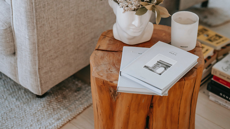 natural wood side table with beige sofa