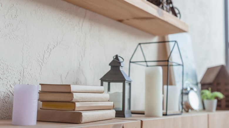 shelves decorated with white candles