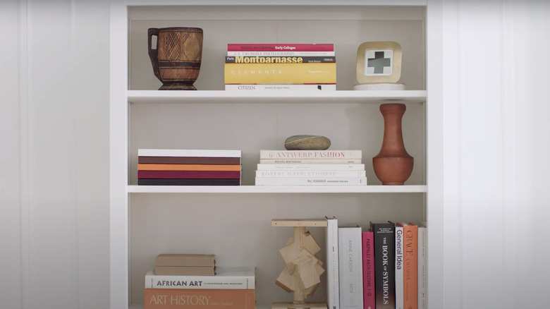 horizontal book stacks on shelf