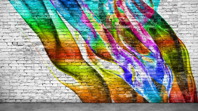 rainbow mural on brick wall