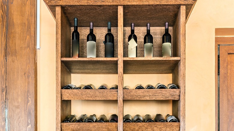 wine bottles in china cabinet