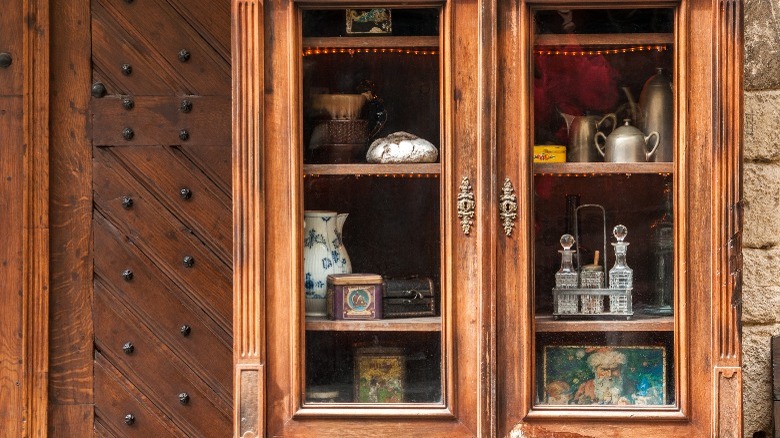 china cabinet with trinkets