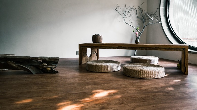 wicker poufs under coffee table