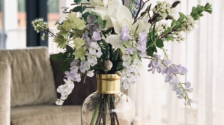gold vase with purple flowers