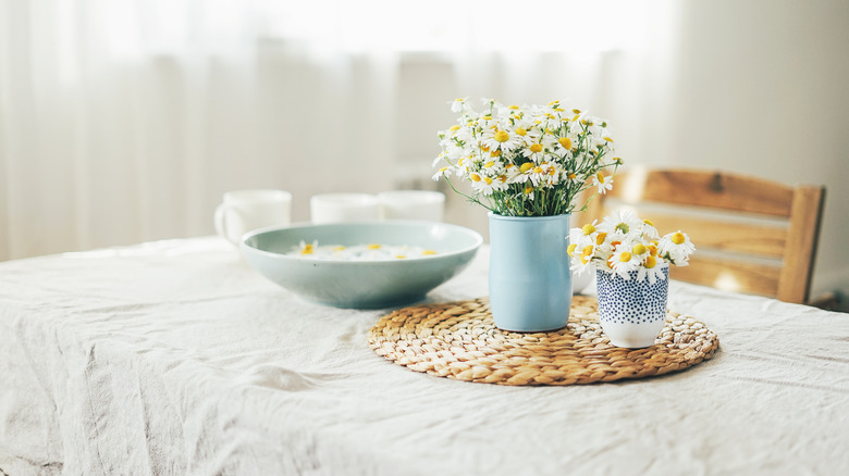 white tablecloth drapes over table