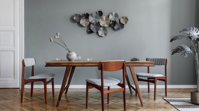 dining chairs and art around table