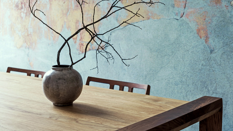 three vases of different heights on table