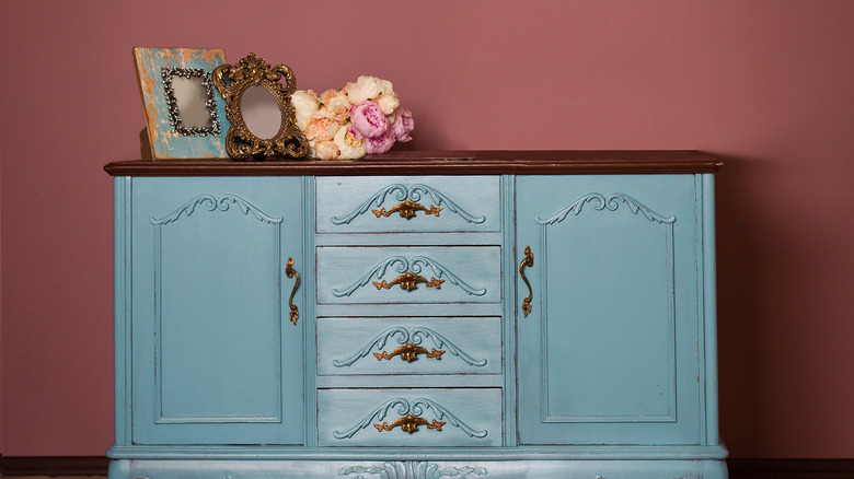  blue vintage dresser with decorative items