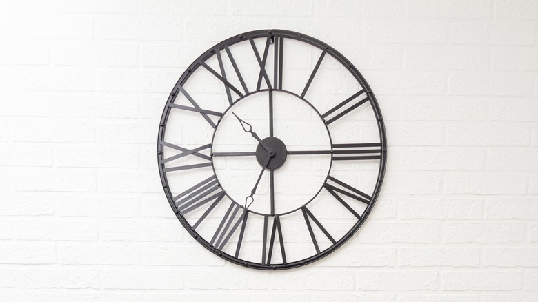 oversized black clock on the wall