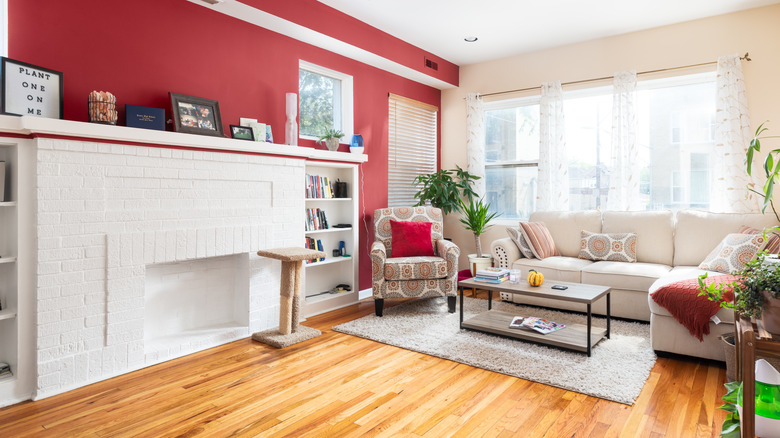 fireplace with red accent wall