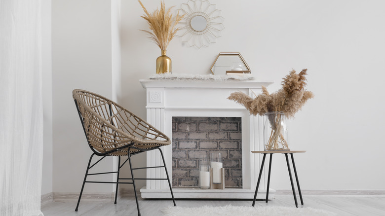 white candles in white fireplace 