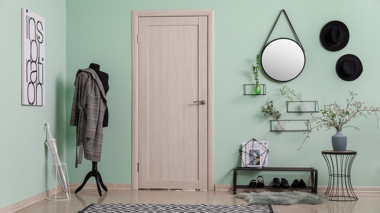 green foyer created with rug