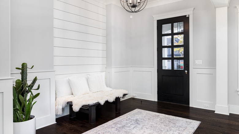 farmhouse foyer with white rug