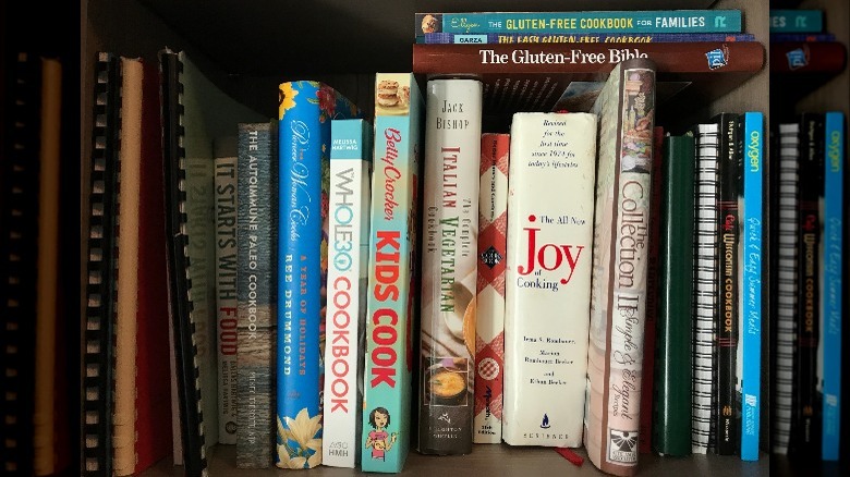 stack of cookbooks on shelf