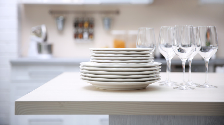 stacked dishes and wine glasses