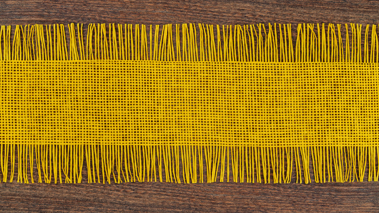 yellow table runner on table 