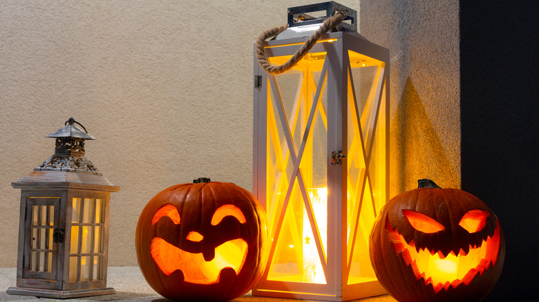 pumpkins placed around a lantern