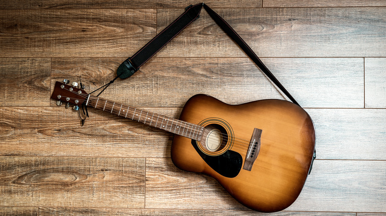 guitar hanging on wall