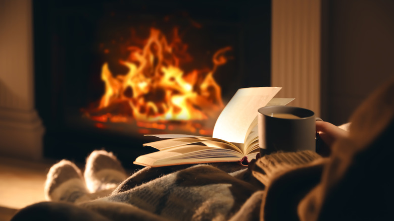 crackling fireplace with book