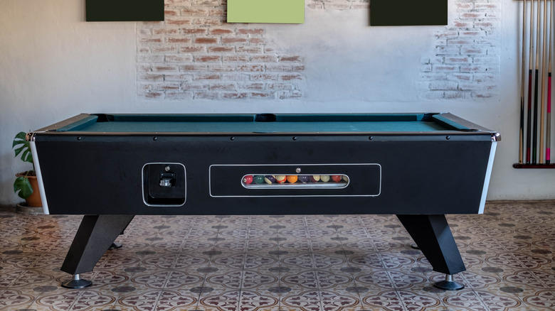 pool table and brick wall